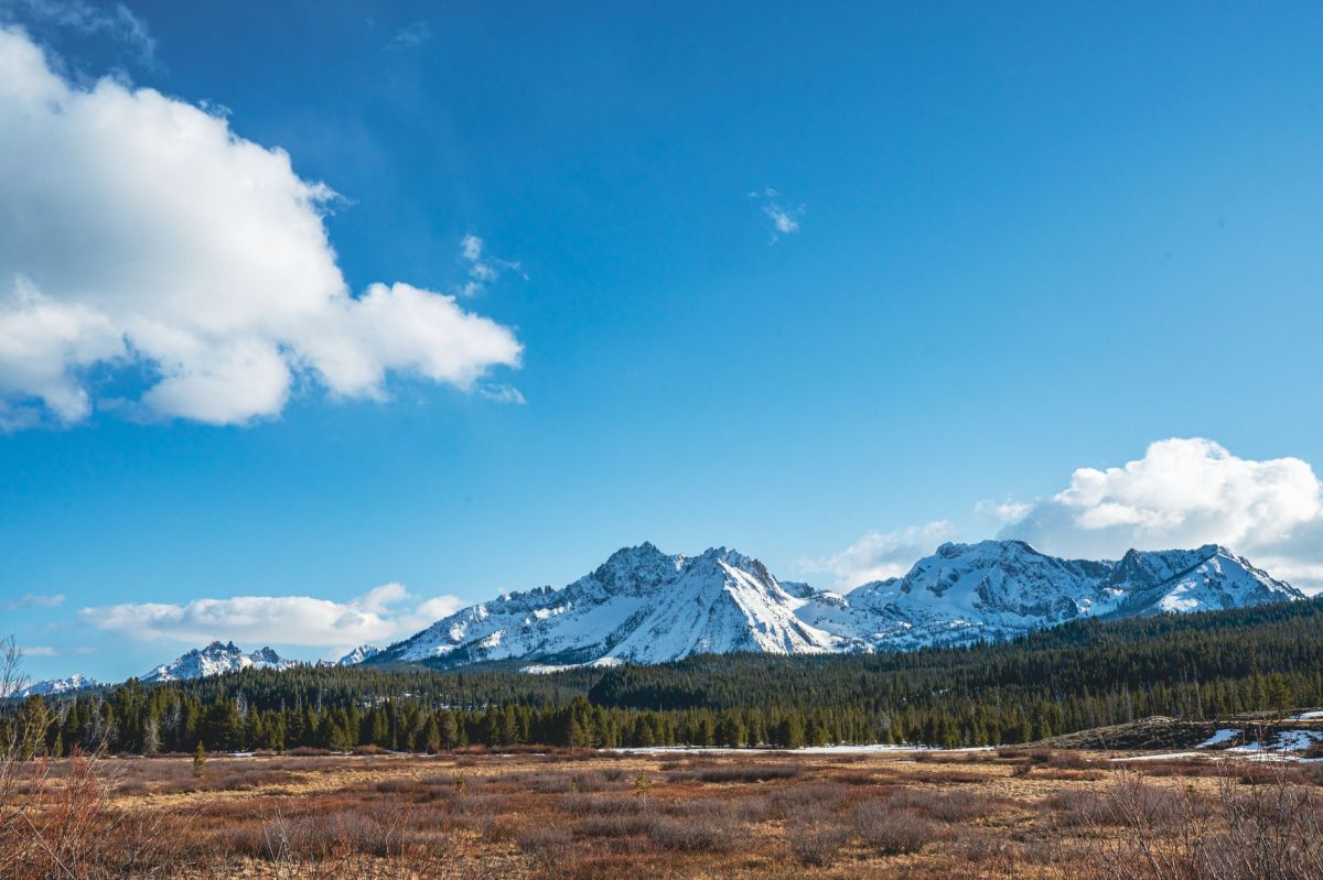 Snow-capped Sawtooth Mountains above a valley near Stanley, Idaho