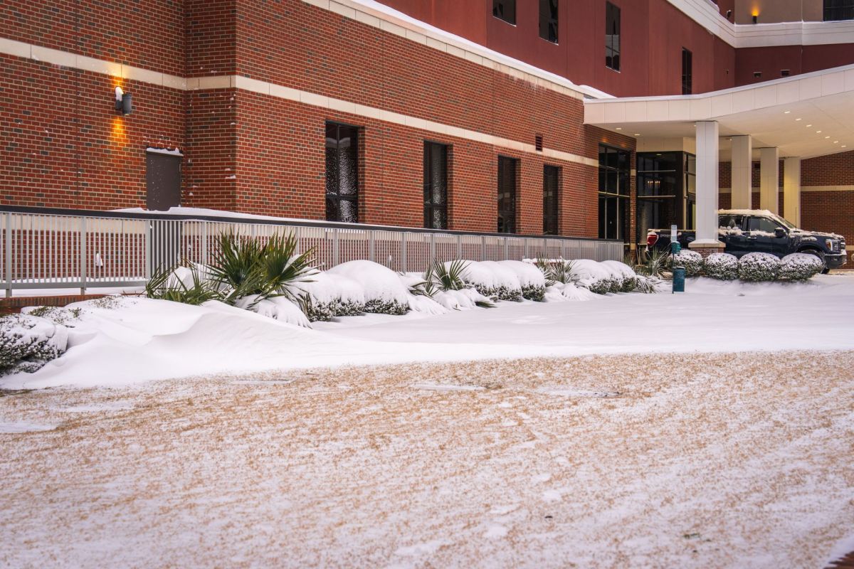 Brick commercial building with snow covering its grounds