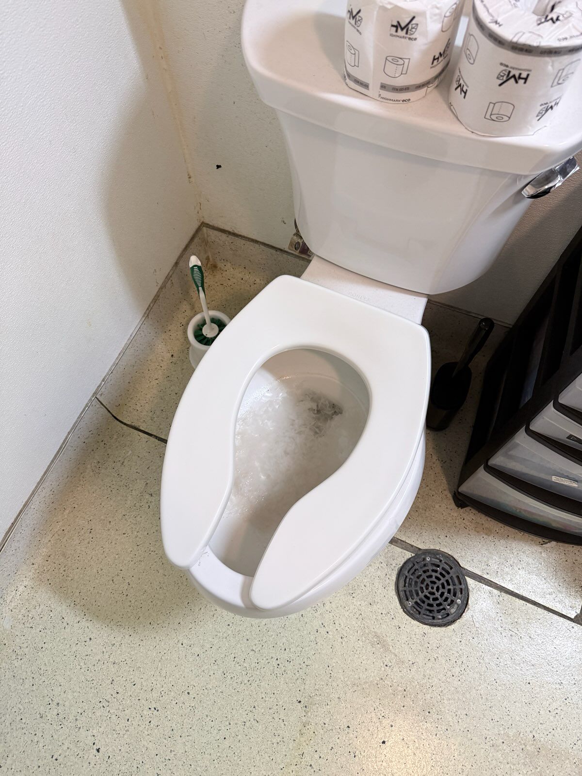 Blocked toilet in a commercial staff restroom